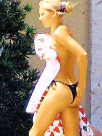 Anna Kournikova topless and in a bikini top