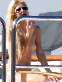 Paris Hilton sunbathing topless