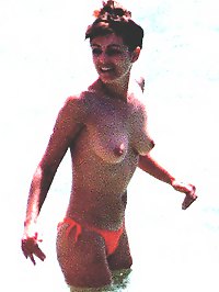 Elizabeth Hurley caught topless on the beach