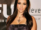 Kim Kardashian deep cleavage and mini skirt