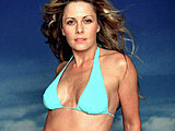 Nicole Eggert looking really hot posing in a blue bikini sexy pics