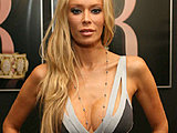 Jenna Jameson showing off her massive cleavage posing in a sexy dress
