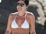 Pop singer Pink caught in a white bikini top suntanning on the yacht