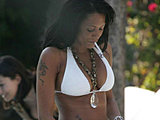 Melanie Brown caught in a white bikini with cigarette in Miami