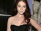 Michelle Trachtenberg showing off her hot legs posing in a short dress