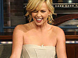 Charlize Theron flaunting her lovely legs in sexy short dress