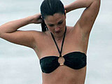 Drew Barrymore caught in a black bikini on the beach with boyfriend