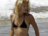 Kate Hudson caught in a teeny black bikini on the beach sexy candids