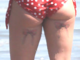 Pink shows tits with rings at nipples & sexy bikini