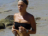 Pop singer Pink caught in a very little top running along the coast
