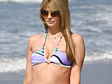 Mischa Barton caught suntanning in a tiny bikini on the beach