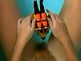 A naked Victoria Abril play with toy in bath