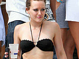 Hilary Duff all smiles on the beach in a sweet black bikini top