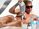 Singer Billie Piper caught tanning topless and bikini candids shoots