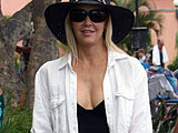 Heather Locklear caught showing off her sexy legs in a black swimsuit