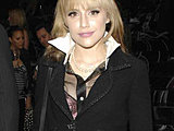Brittany Murphy showing off her hot long legs in a mini-skirts