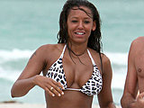 Melanie Brown shows big tits and sexy ass in a tiny bikini candids