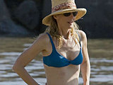 Helen Hunt caught suntanning in a sexy blue bikini and straw hat