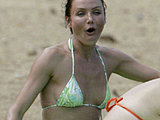 Cameron Diaz caught in a tiny bikini suntanning with her friends
