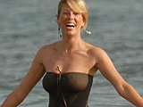 Alessia Marcuzzi showing sweet ass in a thong swimsuit on the beach