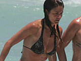 Helena Christensen caught bathing in a tiny wet bikini in Miami beach