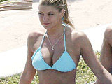 Stacy Ferguson shows amazing breast tanning in a cute thong bikini