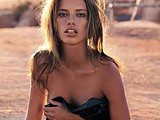 Adriana Lima posing in flirty lingerie and topless outdoors shoots