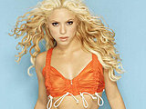 Shakira showing off her flat belly in bra top and sensual curvy hips