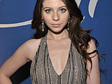 Michelle Trachtenberg showing off sides of her boobs in low-cuted top