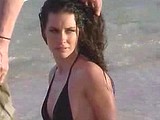Evangeline Lilly posing in tight bikini on a beach