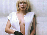 Elisha Cuthbert shows sides of her nude tits in sexy clothes