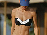 Hilary Swank caught in a cute bikinis on the beach and poolside