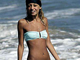 Nicole Richie shows her very skinny body in a tiny bikini on the beach