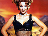 Gillian Anderson looks naturally pretty showing lotsa leg in stockings