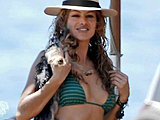 Paulina Rubio caught in a cute bikini getting soaking wet candids