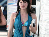 Selma Blair flashing her bikini top in a hot ultra-mini dress