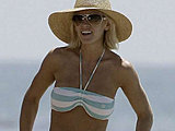 Jenny McCarthy shows her tight body in striped bikini on the beach