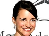 Kristin Davis posing at award show in hot blue dress