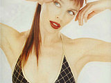 Kylie Minogue looks so sexy posing in a teeny mini bikini top