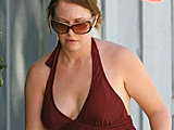 Melissa Joan Hart shows her fat body in a brown swimsuit on the beach