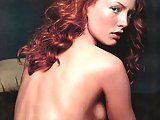 Sexy redhead Alicia Witt expose her tits