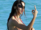 Nina Moric bikini and topless on beach