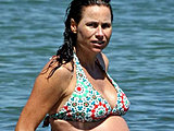 Minnie Driver caught very pregnant in bikini in the river candids