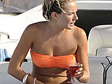 Sienna Miller caught sunbathing in bikini with family on the yacht