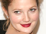 Drew Barrymore sunbathes on a beach