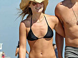 Ali Larter caught in a tiny black bikini on the beach candids