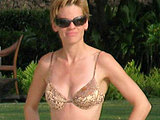 Hilary Swank caught in a sexy bikini sunbathing poolside candids