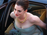 Anne Hathaway flaunts sexy busty & long legs