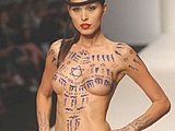Petra Nemcova shows off her perky tits with body paint on the catwalk