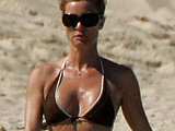 Nicollette Sheridan caught sunbathing in a tiny bikini on the beach